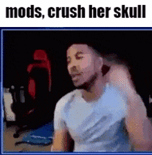 a man is sitting in front of a computer screen with the words `` mods , crush her skull '' on the bottom .