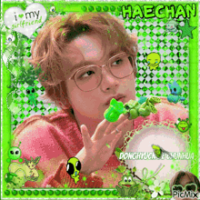 a picture of haechan with a frog in his hand