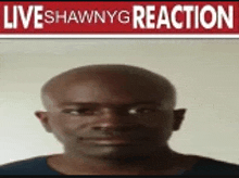 a man is standing in front of a sign that says live shawnyg reaction .