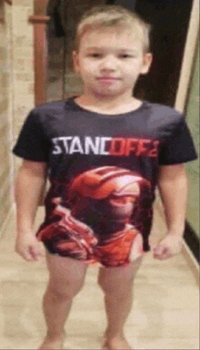 a young boy is wearing a shirt that says standoff 2 on it