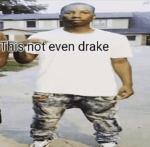 a man is wearing a white shirt that says this not even drake