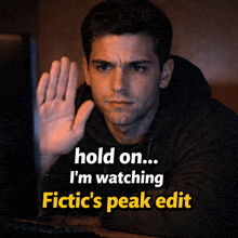 a man waving his hand in front of a computer screen with the words hold on i 'm watching fictic 's peak edit below