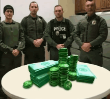 a group of police officers are standing around a table with stacks of money