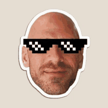 a bald man with a beard wearing pixelated sunglasses .