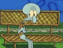 squidward from spongebob squarepants is sitting on a bamboo bench