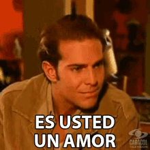 a man says " es usted un amor " in a foreign language