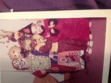 a group of children are posing for a picture while holding trick or treat bags