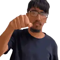 a man with glasses and a beard is pointing his finger