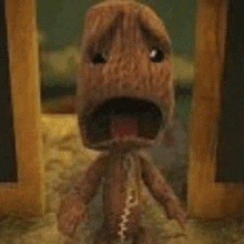 a stuffed animal with its mouth open is standing in a room .