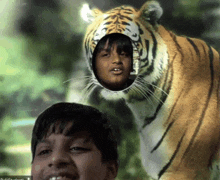 a picture of a boy with a tiger 's head behind him