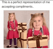 a little girl in a red dress is holding a gift box and smiling .