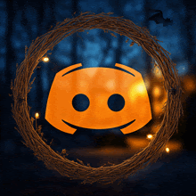 a discord logo is surrounded by a wreath of branches and candles