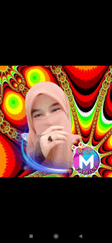 a woman wearing a hijab is covering her face in front of a colorful background that says mozu