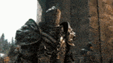 a statue of a knight with a lion head on his armor