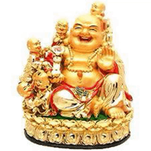 a statue of a laughing buddha sitting on top of a pile of money .