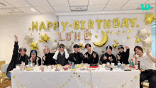 a group of young men are posing for a picture in front of a wall that says happy birthday lune