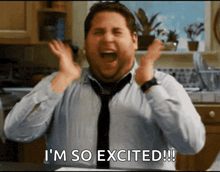 a man in a tie says i 'm so excited !!!