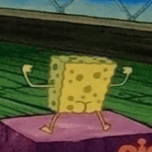 a spongebob squarepants cartoon character is standing on a pink block .