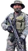 a soldier wearing a face mask holds a rifle