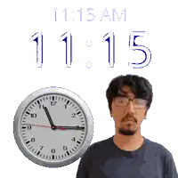 a man stands in front of a clock that reads 11:15