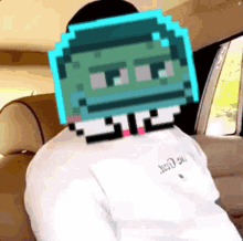 a person is sitting in a car with a pixelated head on their head .