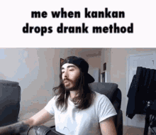 a man with long hair is sitting in front of a computer with the caption " me when kankan drops drank method " on the top