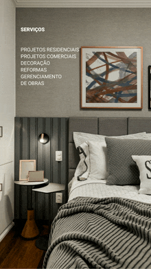 a bedroom with a striped headboard and a picture on the wall that says ' serviços ' on it