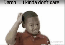 a young boy in a red shirt is scratching his head and says damn ... i kinda don 't care