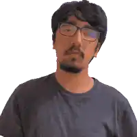 a pixelated image of a man wearing glasses and a beard
