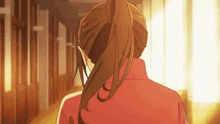 a girl with a ponytail and a red jacket is walking down a hallway