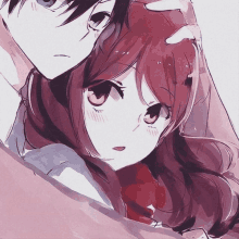 a boy and a girl are hugging each other and the girl is wearing a red scarf