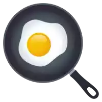 a frying pan with a fried egg on it