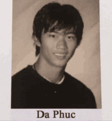 a black and white photo of a young man with the name da phục on the bottom