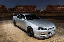 a silver sports car with a license plate that says 01-612