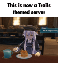 a girl is sitting at a table eating pancakes and drinking milk