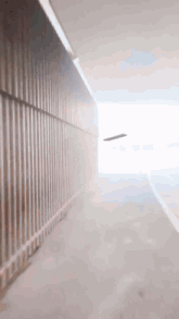 a blurred image of a tunnel with a white light coming out of it