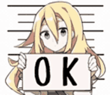 a girl with blonde hair is holding a sign that says `` ok '' .