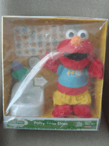 a sesame street potty time elmo toy in a yellow box