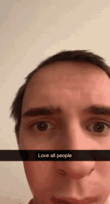 a close up of a man 's face with the words love all people written on it