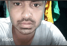 a close up of a man 's face with the words video visible