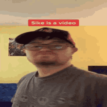 a man wearing glasses and a hat with the words sike is a video