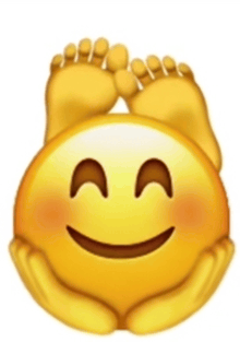 a yellow smiley face with a pair of feet on it