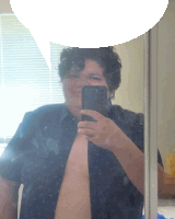 a man taking a picture of himself in a mirror with a speech bubble above him