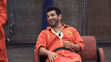a man in an orange jumpsuit with the word coz on the front
