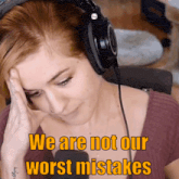 a woman wearing headphones with the words " we are not our worst mistakes " above her