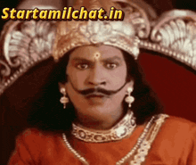 a man with a mustache and a crown is sitting on a throne with the website starttamilchat.in written above him