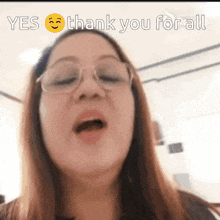 a woman wearing glasses says yes and thank you for all