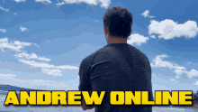 a man looking out over a body of water with the words andrew online above him
