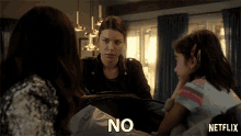 a netflix ad shows a woman holding a suitcase with the word no written on it