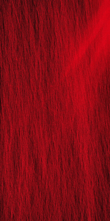 a close up of a red surface with a texture